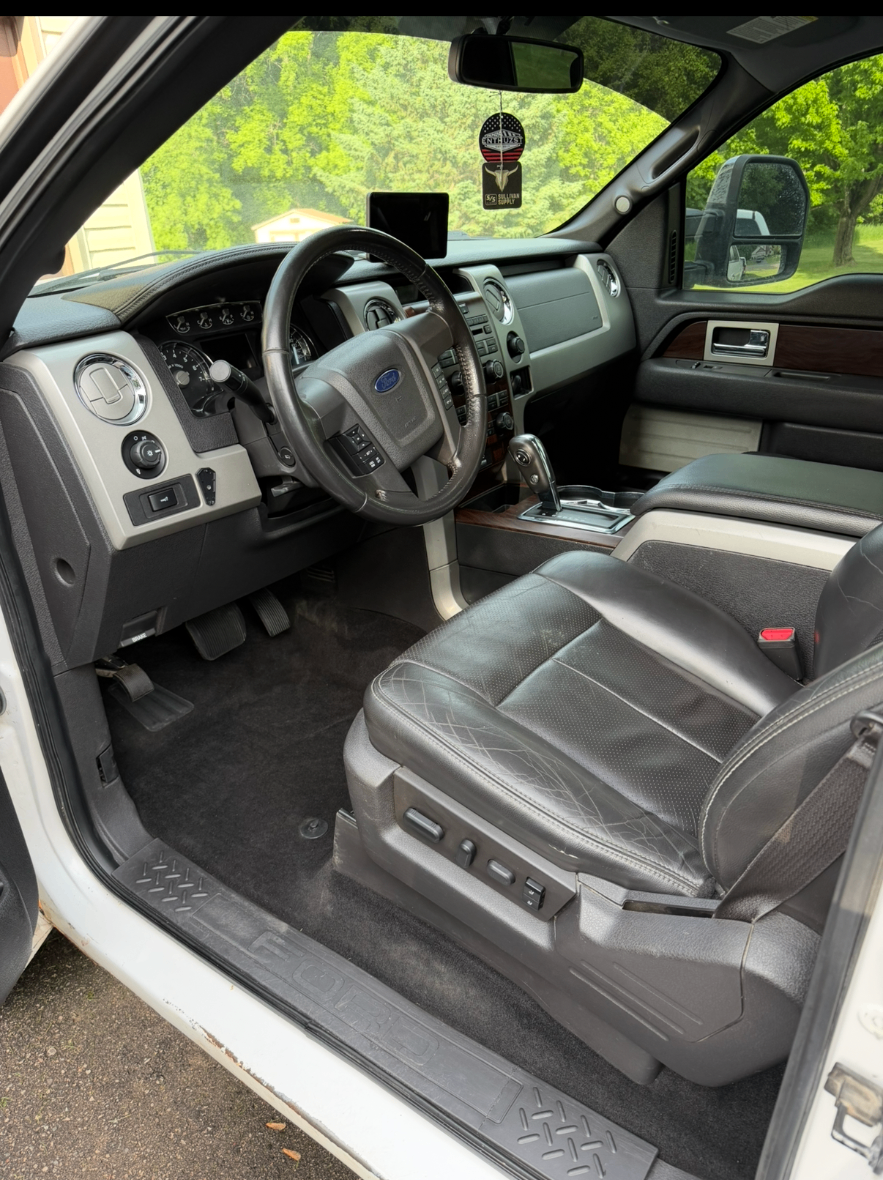 Detailed Ford F-150 interior with shampooed carpets and clean leather